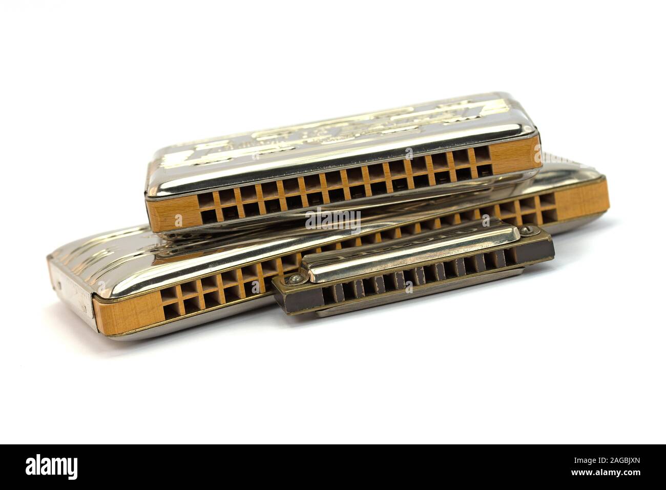 Trois harmonica against white background Banque D'Images
