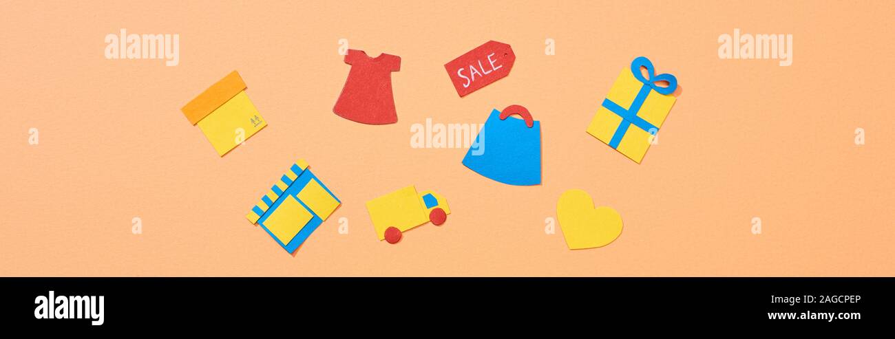 Vue de dessus d'icônes isolé sur fond couleur pêche, vue panoramique tourné Banque D'Images