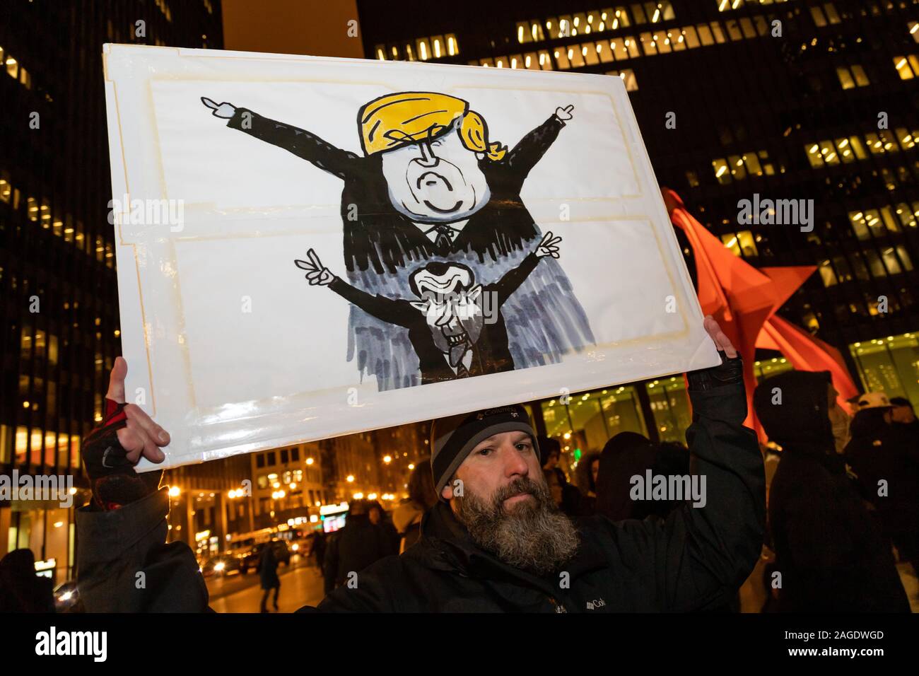 Chicago meeting de protestation à l'appui de l'impeachment du président Donald Trump, qui a eu lieu dans les Plaza sur une journée froide, le jour avant le vote de destitution doit avoir lieu. Banque D'Images
