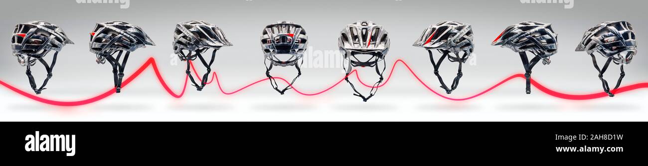 Studio shot de couleur camouflage gris casque de vélo d'affilée isolé sur blanc. Publicité décoration tourné avec une ligne lumineuse rouge Banque D'Images