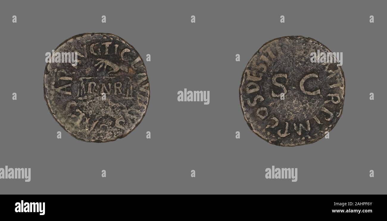 Ancienne cité romaine. Médaille représentant la main avec des écailles. 41-AD 54 AD. L'Empire romain. Le Bronze Banque D'Images