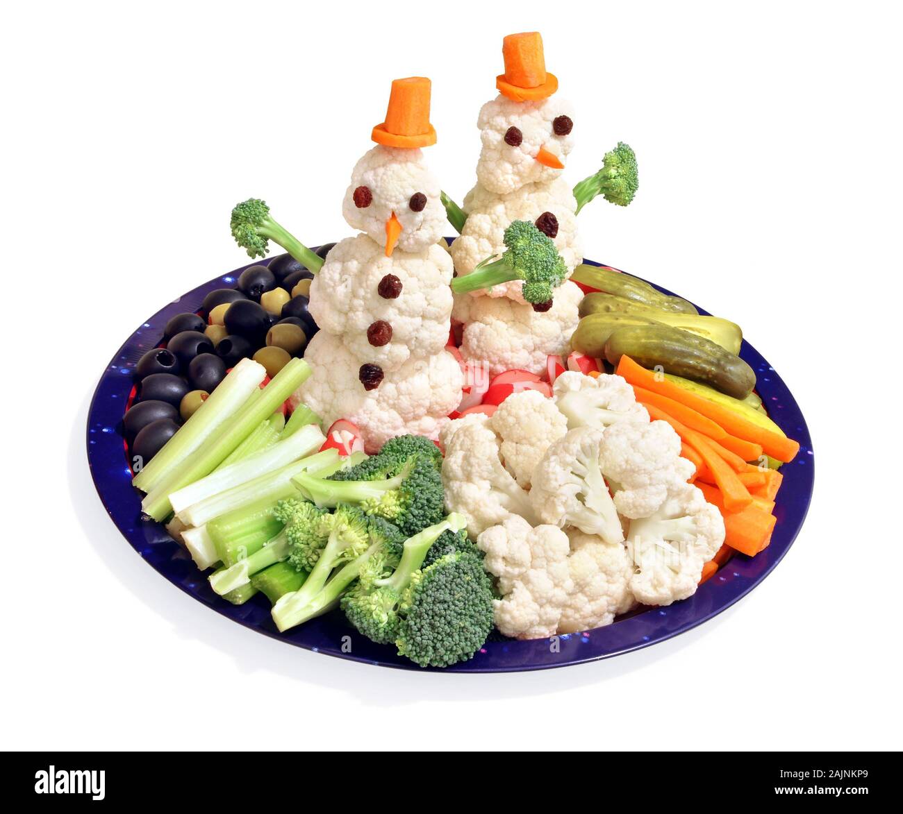 Chou-fleur comestible bonhommes de crudités, un moyen amusant pour les enfants de manger des légumes Banque D'Images