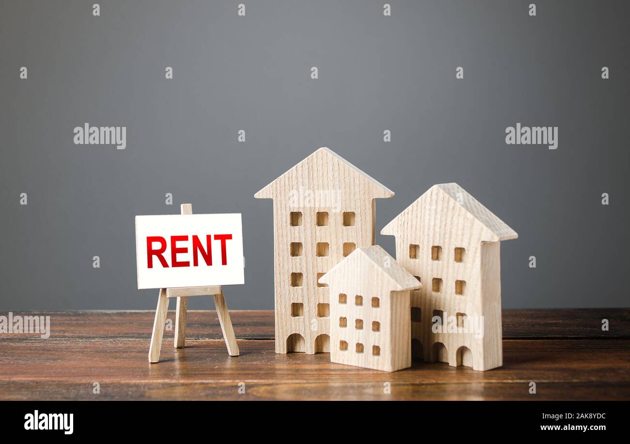 Trois figures de maisons et d'un chevalet avec le mot louer. Les services de l'agent immobilier, recherche des meilleures options. La notion de logement de location temporaire et rea Banque D'Images