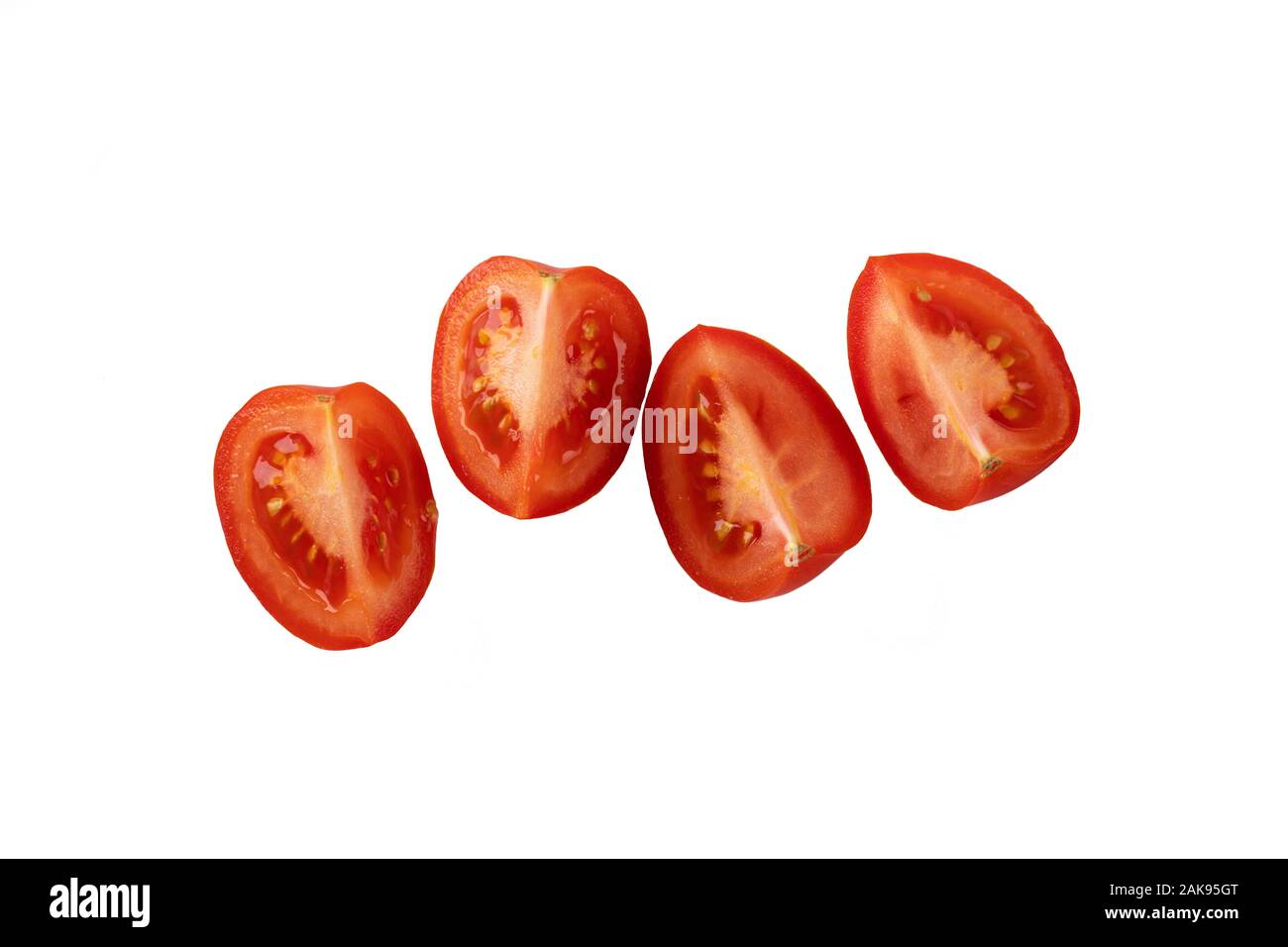 Quarts de tomate. rouge juteuse de tranches de tomate. Banque D'Images