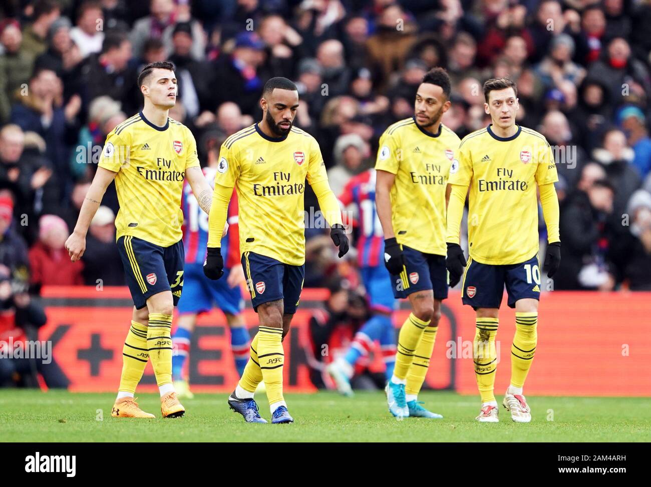 L'Arsenal (de gauche à droite) Granit Xhaka, Alexandre Lacazette, Pierre-Emerick Aubameyang et Mesut Ozil semblent déprimés après Crystal Palace's Jordan Ayew (pas sur la photo) du côté marque son premier but du jeu au cours de la Premier League match à Selhurst Park, Londres. Banque D'Images