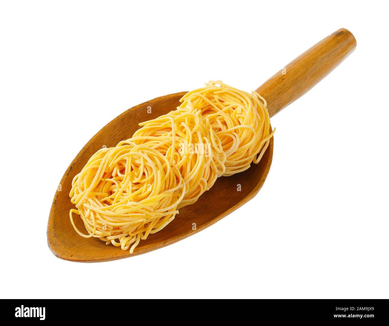 Des paquets de pâtes spaghetti dans scoop en bois Banque D'Images Des paquets de pâtes spaghetti dans scoop en bois Banque D'Images