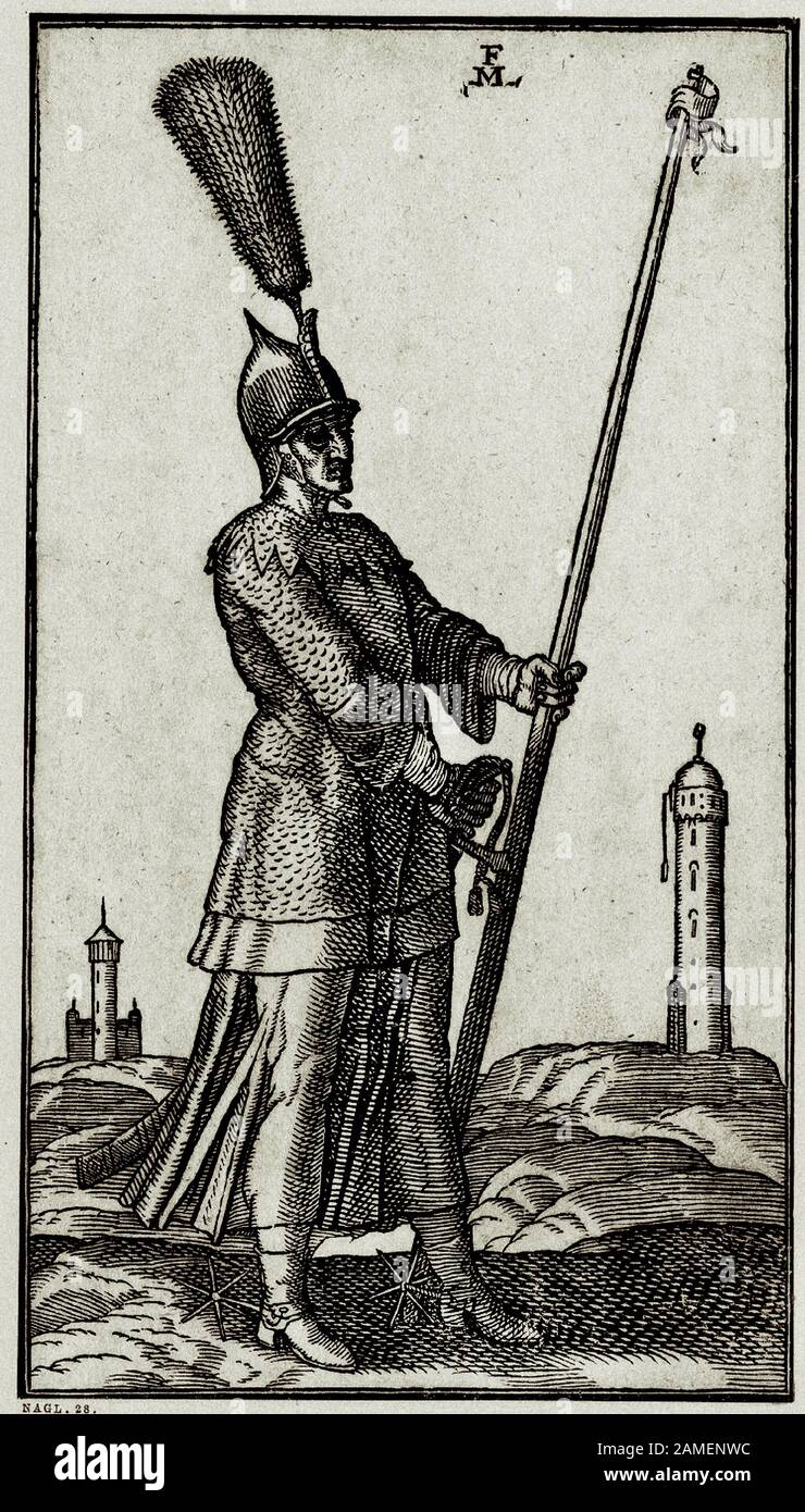 L'histoire de l'Empire ottoman. Un soldat turc qui porte une lance porte un casque avec une crête et un bouquet de plumes; aussi des éperons; en arrière-plan un m Banque D'Images