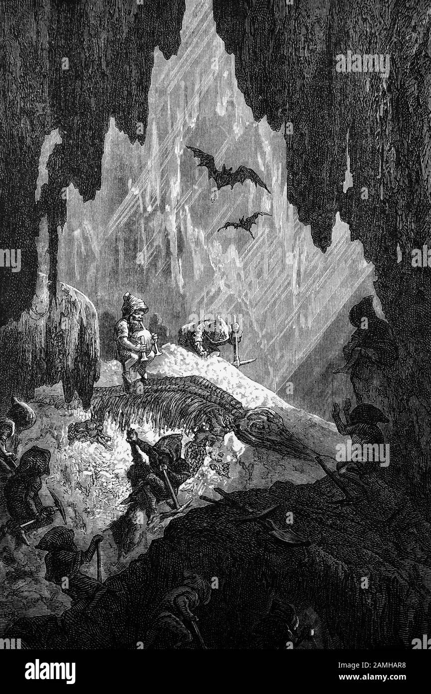 Les Gnomes allemands ou les Pharyes, les gardiens des trésors, des mines et des pierres Précieuses creusant un Ichthyosaure, un genre D'Ichthyosaures du Trias tardif et du Jurassique précoce. Des centaines de squelettes fossilisés bien conservés ont été retrouvés dans le roc jurassique à Holzmaden, en Allemagne. Banque D'Images