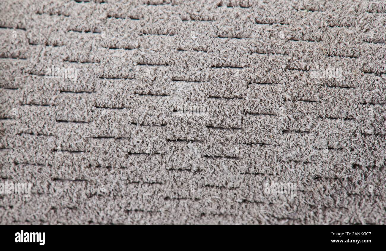 Fond tissu duveteux gris perforé vue rapprochée Banque D'Images