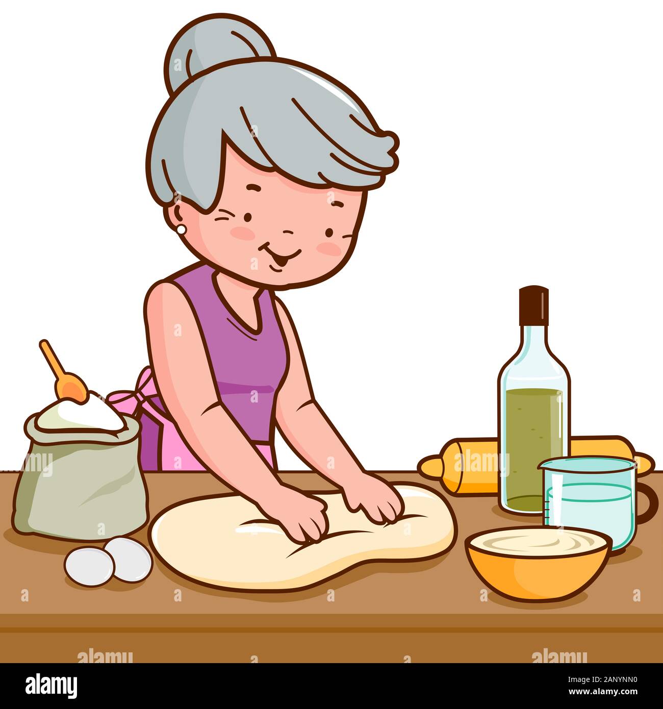 Vieille femme pétrir la pâte et faire du pain dans sa cuisine. Banque D'Images
