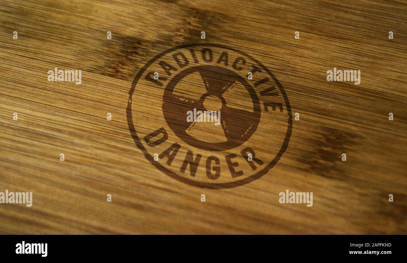Symbole de danger radioactif imprimé sur une boîte en bois. Concept d'avertissement d'énergie atomique, d'alerte aux radiations et de risque d'énergie nucléaire. Banque D'Images