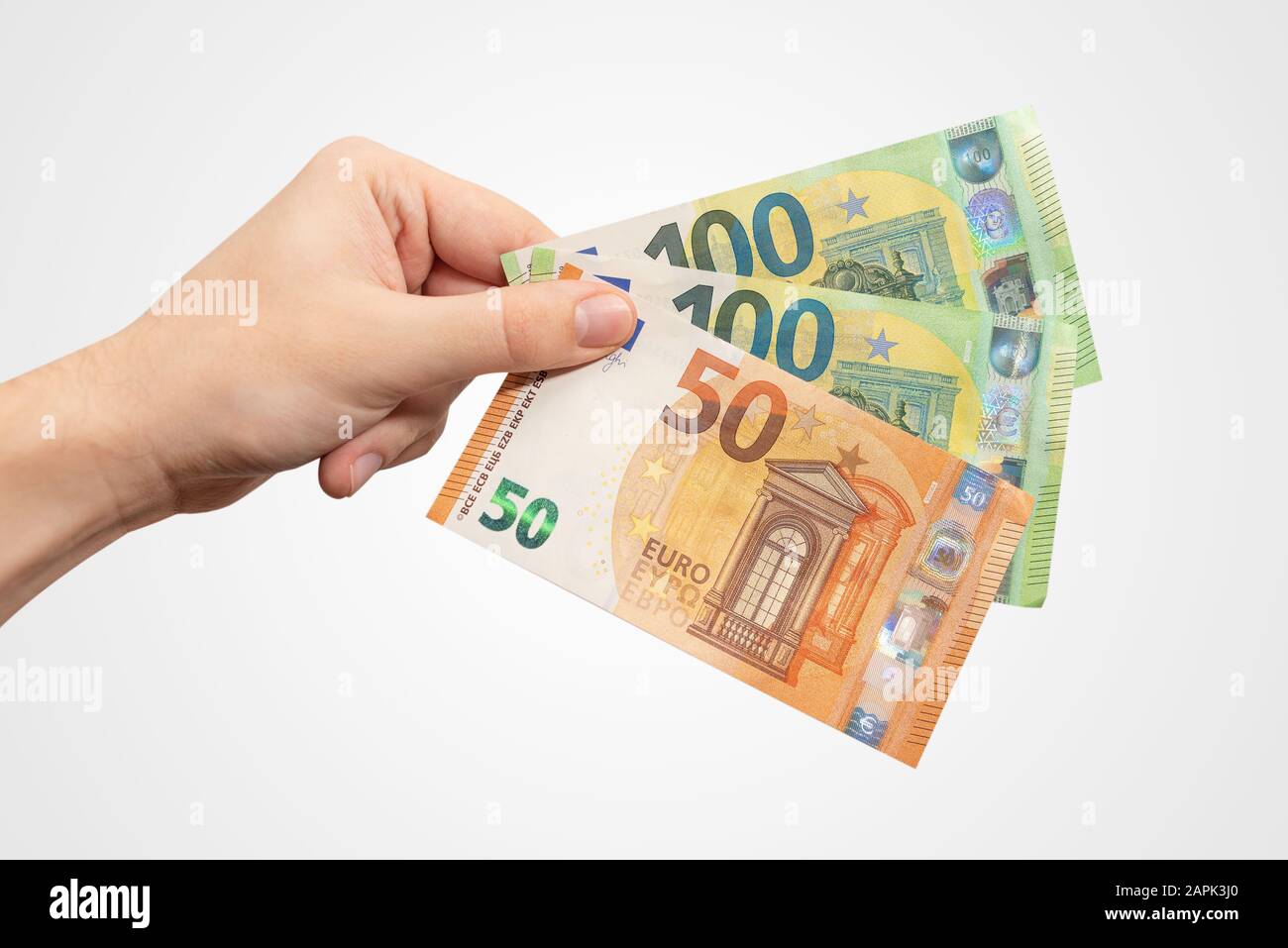 Main contenant des billets EUR. Monnaie européenne, concept de salaire ou de prêt, isolé à la main Banque D'Images