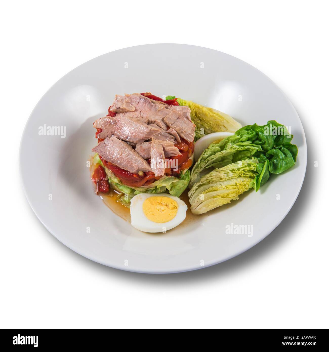 Salade de poivrons rôtis de Zorongollo avec laitue, bonito et oeuf gras Banque D'Images