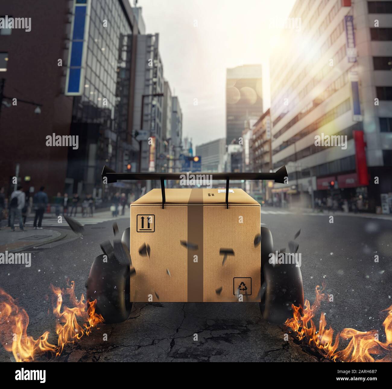 Boîte en Carton prioritaire avec roues de course qui courent dans la ville comme une voiture. Expédition rapide par la route. Banque D'Images