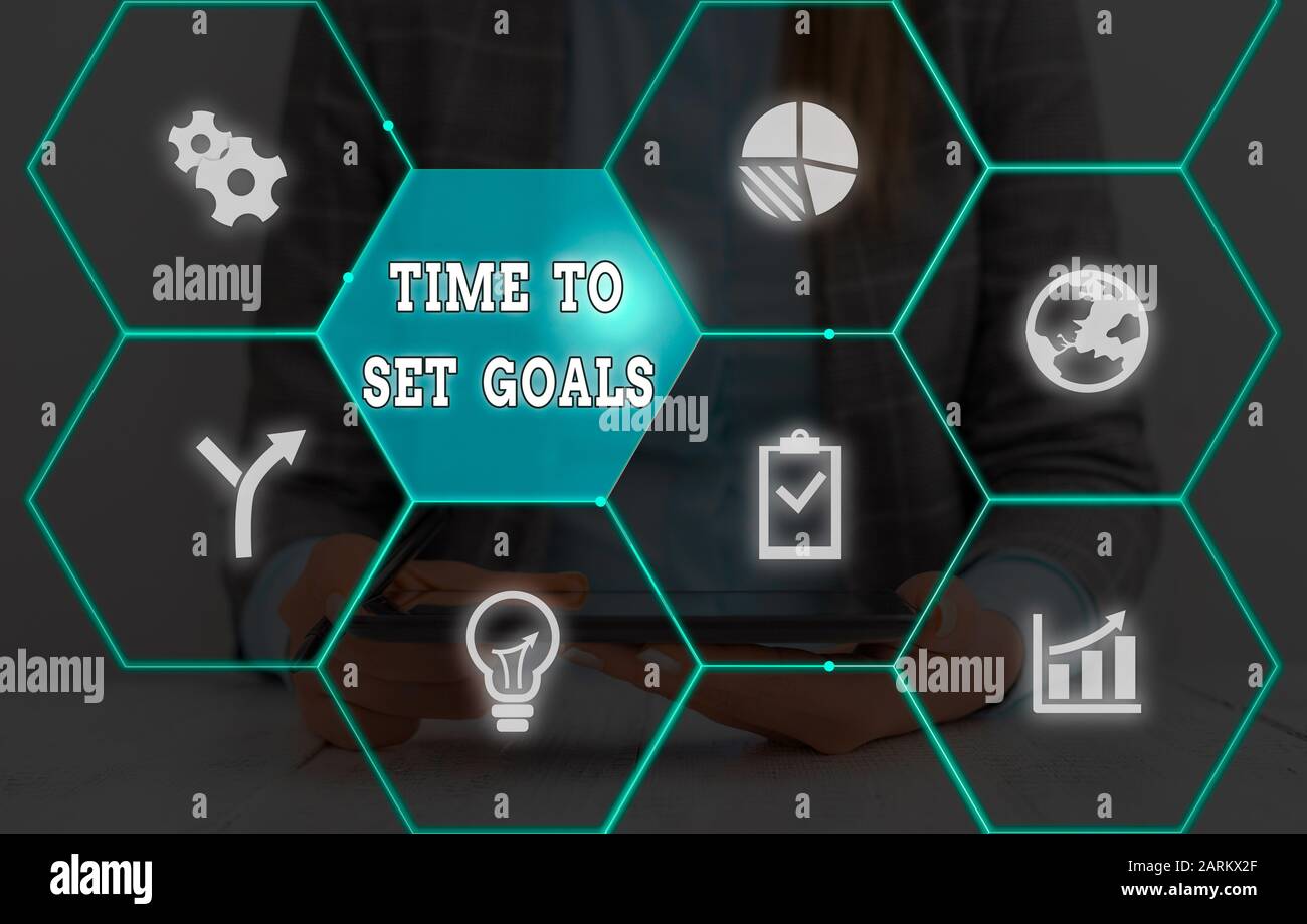 Notez par écrit indiquant le temps de définir vos objectifs. Concept d'affaires pour atteindre l'objectif voulu accomplir dans l'avenir Banque D'Images