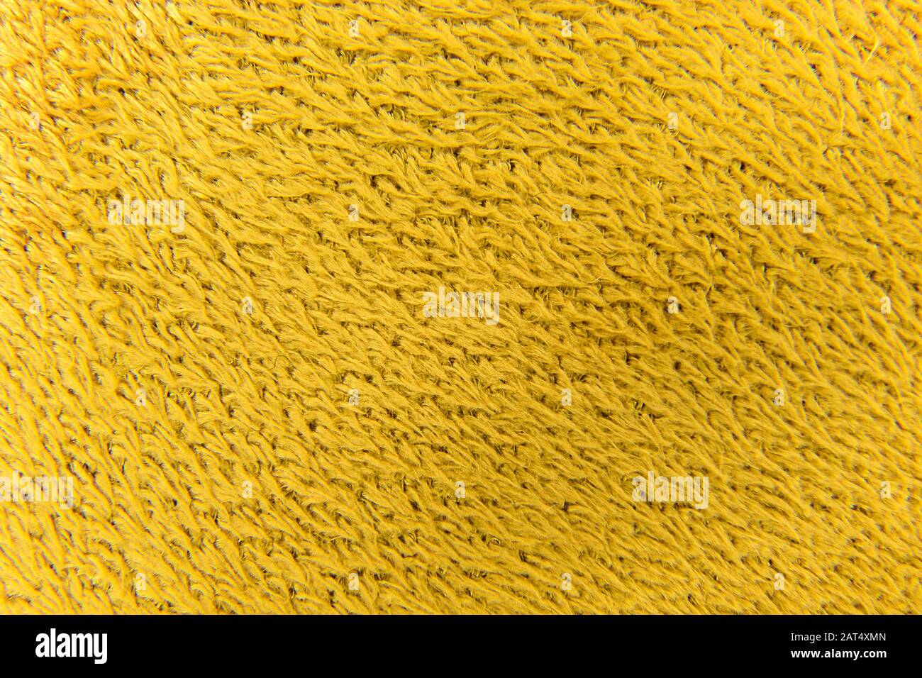 fond d'image en tissu fleuri de laine synthétique jaune Banque D'Images