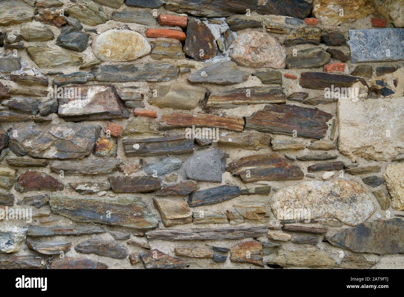 Gros plan sur un mur de pierre naturel Banque D'Images