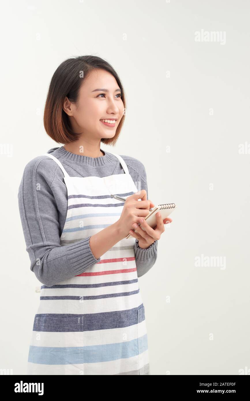 Asie Barista serveur prendre commande auprès du client, le propriétaire du café écrivant la commande de boissons Banque D'Images