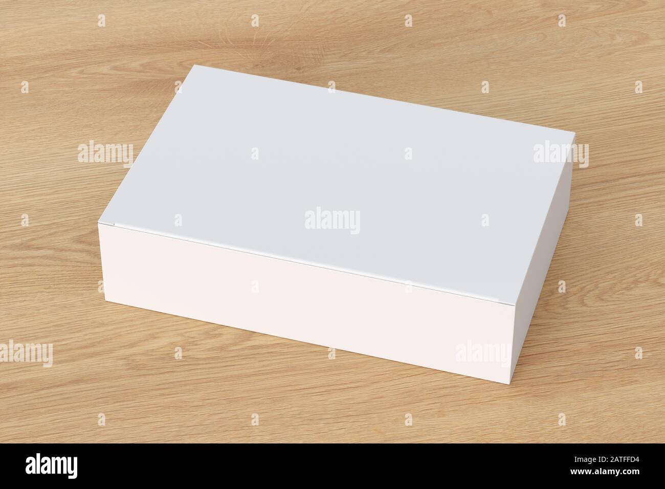 Boîte plate large blanche vierge avec couvercle rabattable fermé sur fond en bois. Chemin de détourage autour de la maquette de boîte Banque D'Images