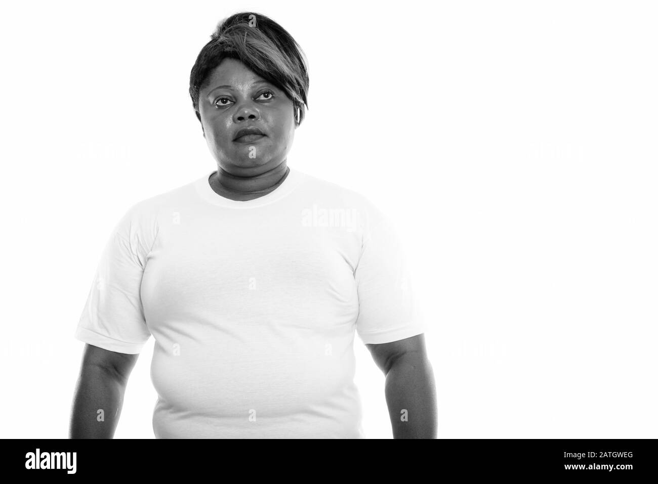 Studio shot of fat black African woman thinking prêt pour salle de sport Banque D'Images