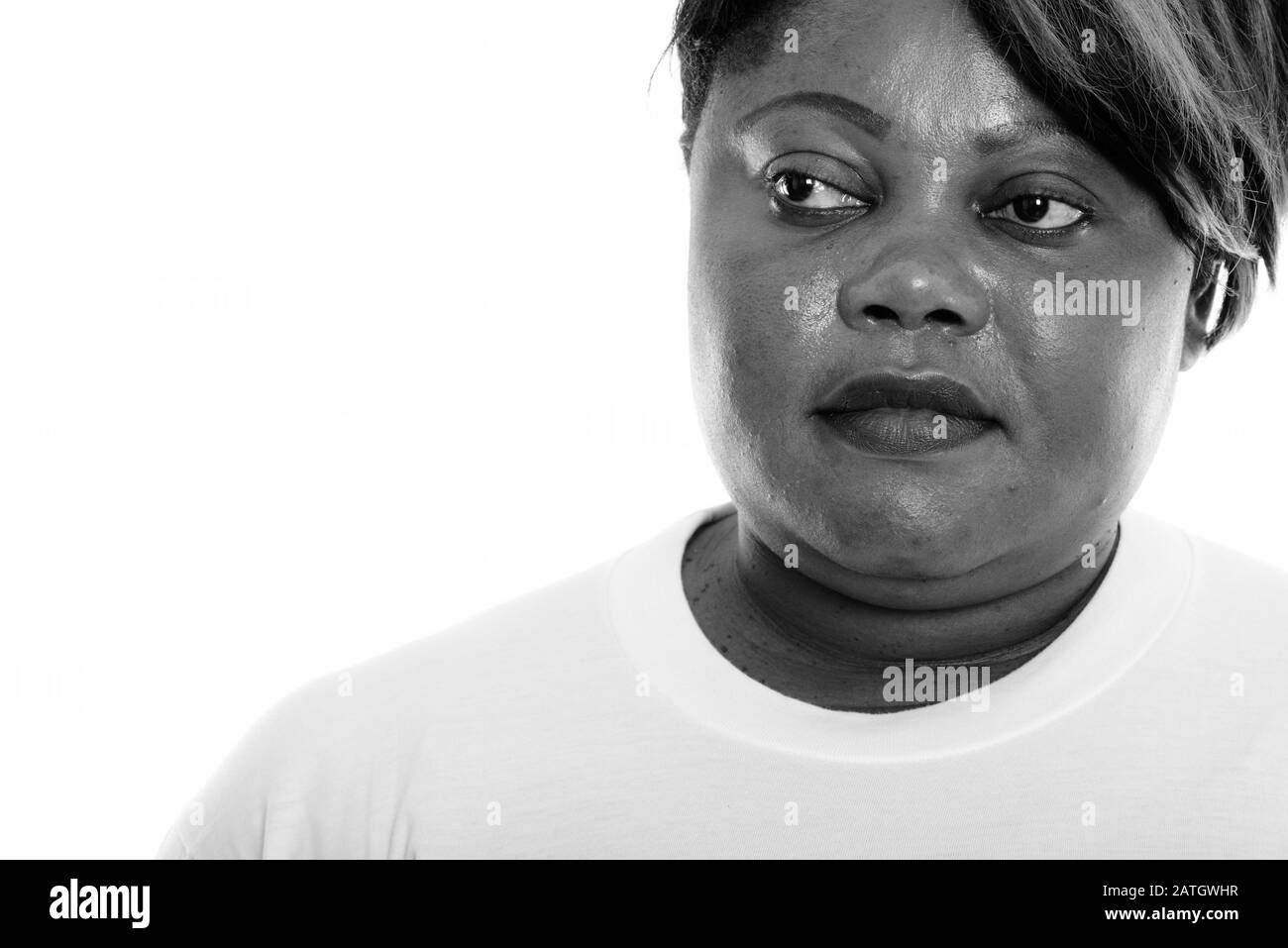 Close up of fat black African woman thinking prêt pour salle de sport Banque D'Images