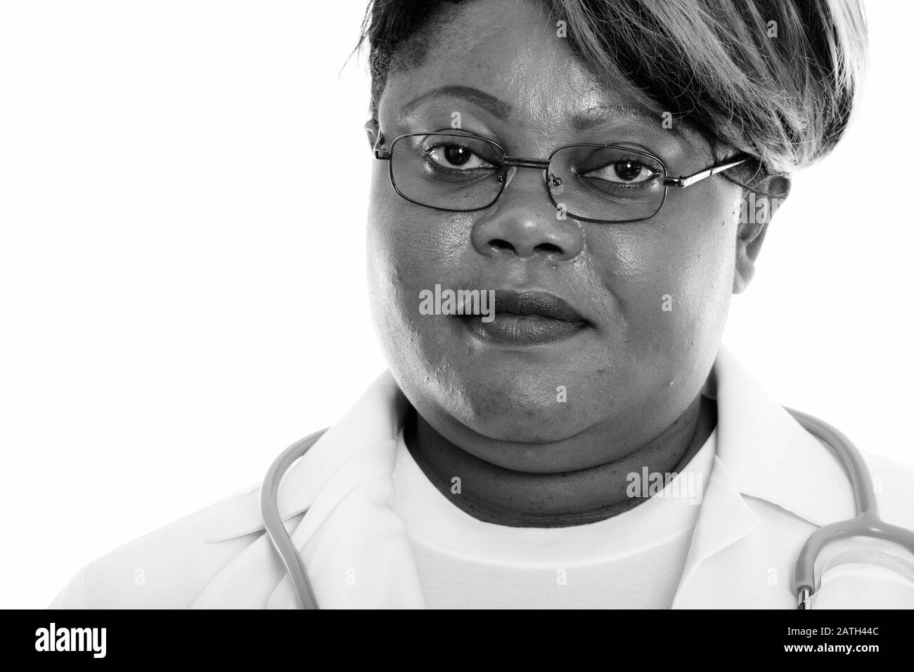 Close up of fat black African woman doctor wearing eyeglasses Banque D'Images