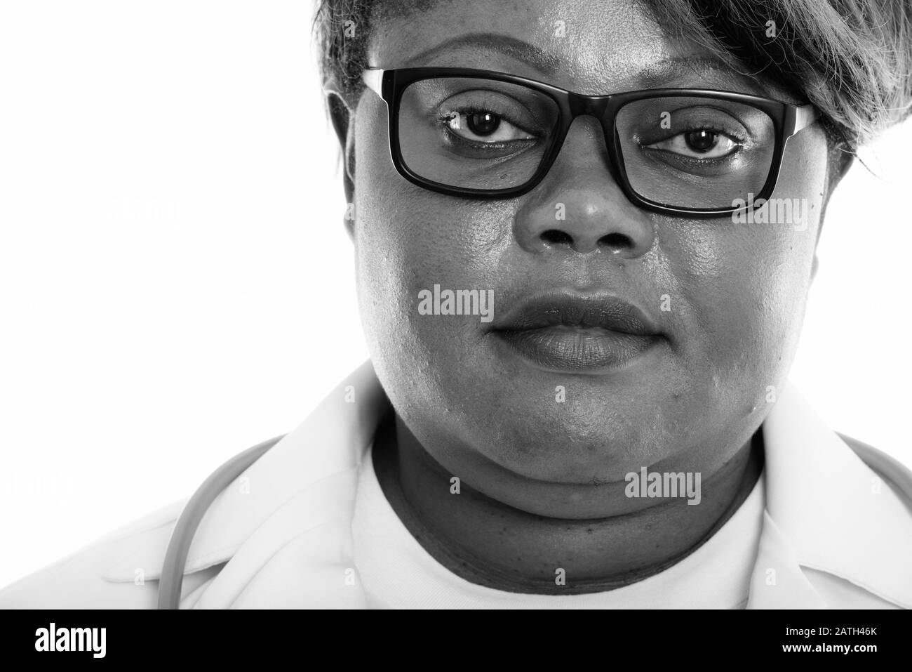 Close up of fat black African woman doctor wearing eyeglasses Banque D'Images