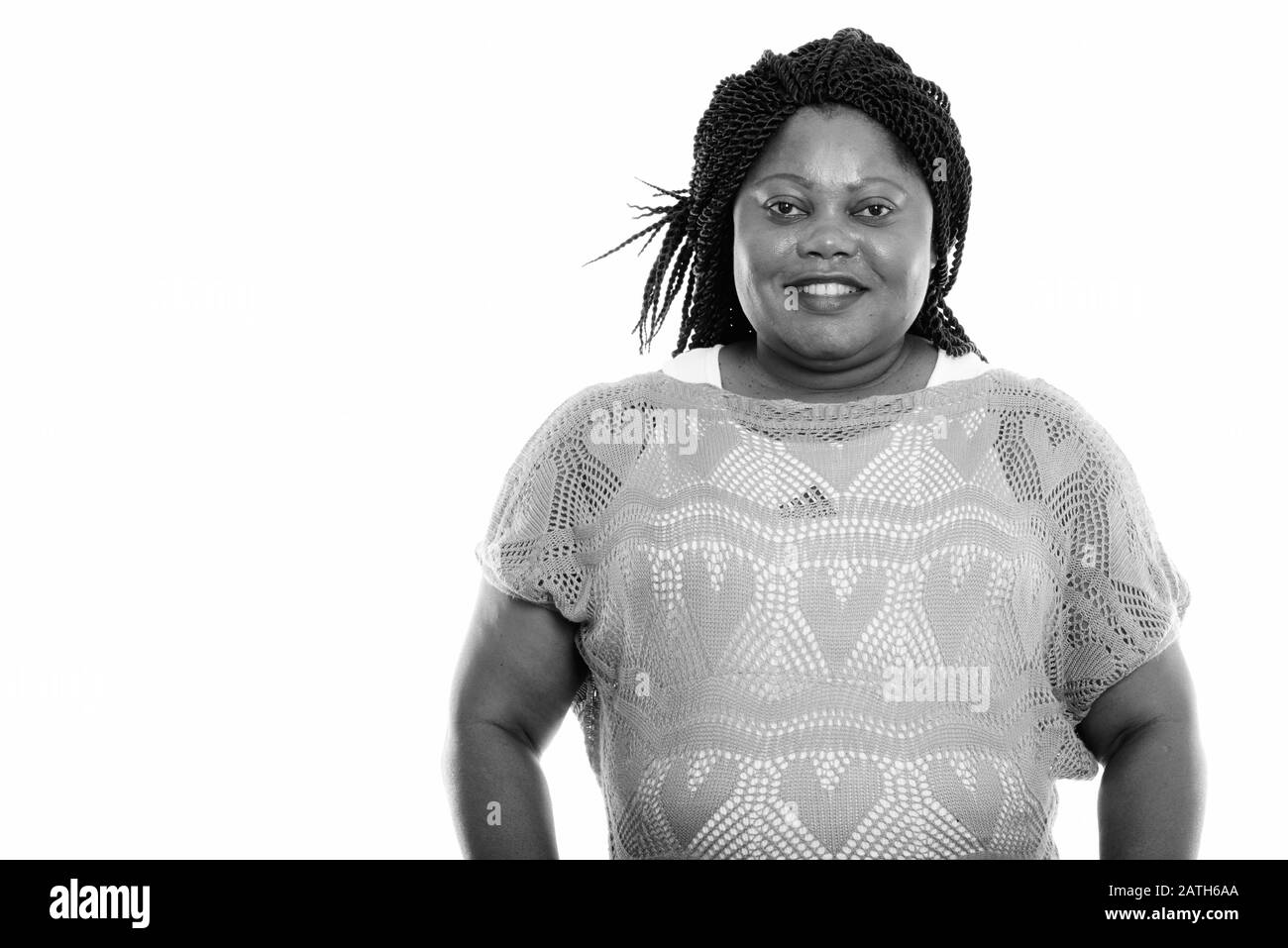 Studio shot of happy fat black African woman smiling Banque D'Images