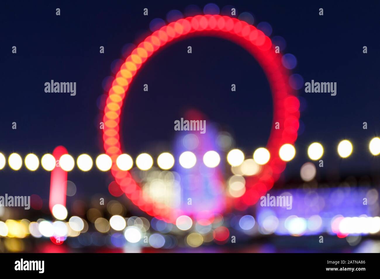 Bokeh Abstract de London Eye ou roue du millénaire de nuit à Londres, Royaume-Uni Banque D'Images