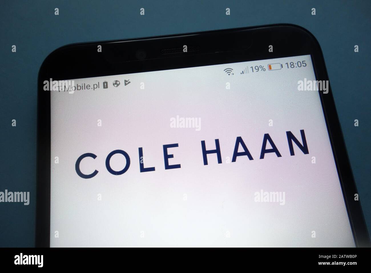 Logo Cole Haan sur smartphone Banque D'Images