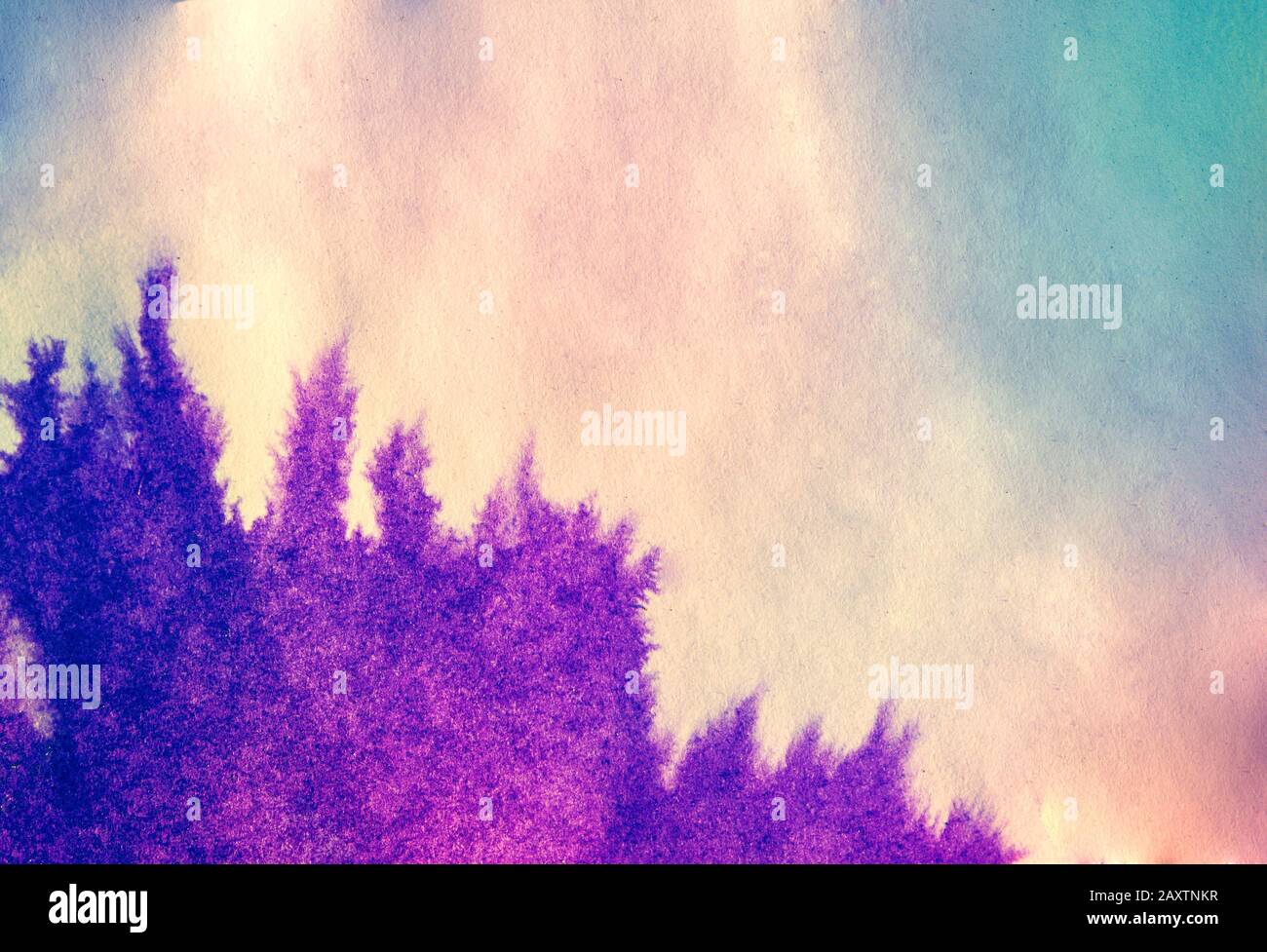 le point d'encre se répand sur du papier de couleur pourpre et rose Banque D'Images