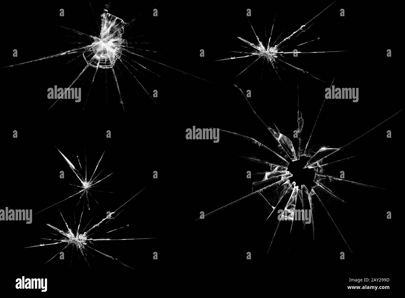 Fissures dans le verre sur un fond noir. Abstraction Banque D'Images