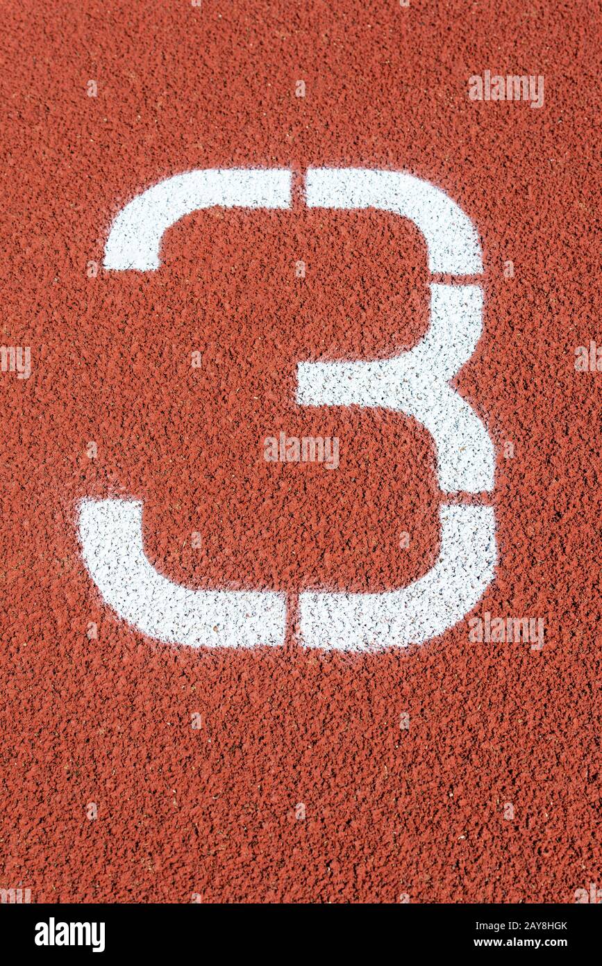 Marque de piste sur une piste d'athlétisme Banque D'Images