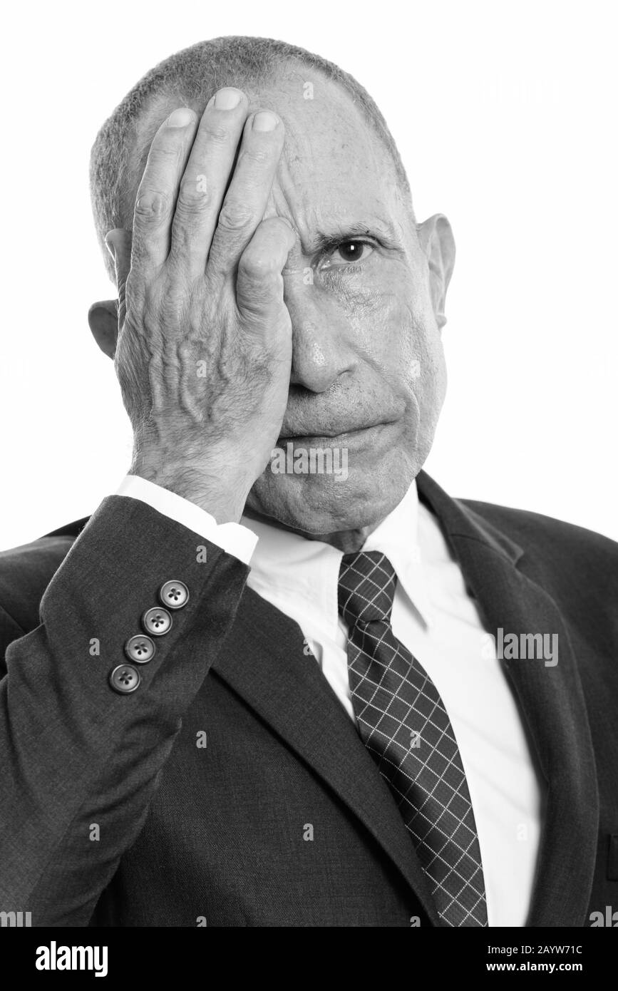 Portrait d'homme d'affaires senior stressé ayant mal à la tête Banque D'Images