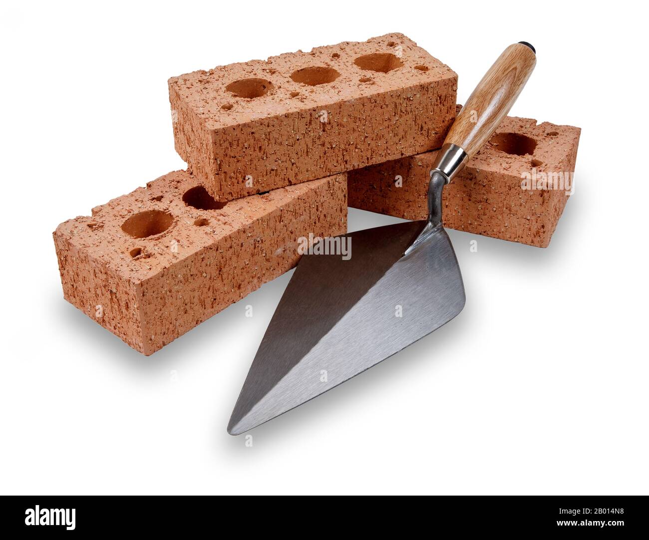 Un ensemble de briques de construction de maison et de truelle, isolé sur un fond blanc avec une ombre de goutte Banque D'Images