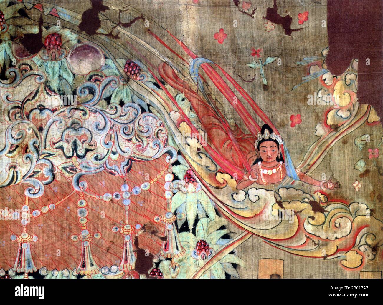 Chine : une apsara ou une jeune fille céleste.Toile de défilement suspendue, Grottes de Mogao, Dunhuang, 9th siècle.Les Apsaras sont de belles femmes surnaturelles.Ils sont jeunes et élégants, et maîtrisent l'art de la danse.Ils sont les femmes des Gandharvas, les serviteurs de la cour d'Indra.Ils dansent à la musique faite par leurs maris, habituellement dans les palais des dieux, et divertissent les dieux et les héros déchus.Les Apsaras seraient capables de changer leur forme à volonté, et de régner sur les fortunes des jeux et des jeux de hasard.Urvasi, Menaka, Rambha et Tilottama sont les plus célèbres d'entre eux. Banque D'Images