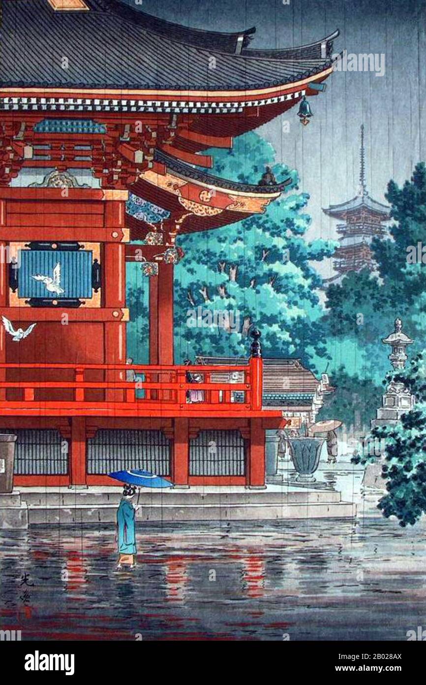 Japon : « pluie comme temple Asakusa Kannon, Tokyo ». Shin Hanga ukiyo-e estampe sur bois de Tsuchiya Koitsu (23 septembre 1870 - 13 novembre 1949), 1933. Tsuchiya Koitsu est un artiste du mouvement Shin Hanga. Il a été formé sous la direction du maître ukiyo-e Kobayashi Kiyochika pendant 19 ans, et ses œuvres initiales se sont concentrées sur des scènes de la première guerre sino-japonaise. Le Shin hanga (« nouvelles estampes ») est un mouvement artistique au début du XXe siècle au Japon, pendant les périodes Taishō et Shōwa, qui revitalise l'art ukiyo-e traditionnel enraciné dans les périodes Edo et Meiji (XVIIe-XIXe siècle). Banque D'Images