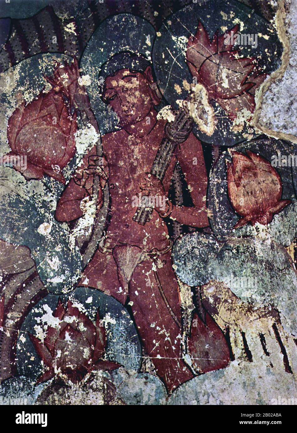 Inde : Lotus-Gatherer. Murale du complexe de grottes Jain à Sittanavasal, district de Pudukkottai, Tamil Nadu, IIe siècle de notre ère. Sittanavasal est un petit hameau dans le district de Pudukkottai du Tamil Nadu, en Inde. La grotte Sittanavasal, également connue sous le nom d'Arivar Kovil, est un monastère jaïn du VIIe siècle, de petite taille, creusé dans une falaise sur le versant ouest de la colline en son centre. Il est connu pour ses peintures qui ont été peintes dans la technique fresco-secco avec de nombreuses couleurs minérales. Les thèmes de peinture représentent un magnifique étang de lotus et des fleurs, avec des gens qui collectionnent des lotus de l'étang. Banque D'Images