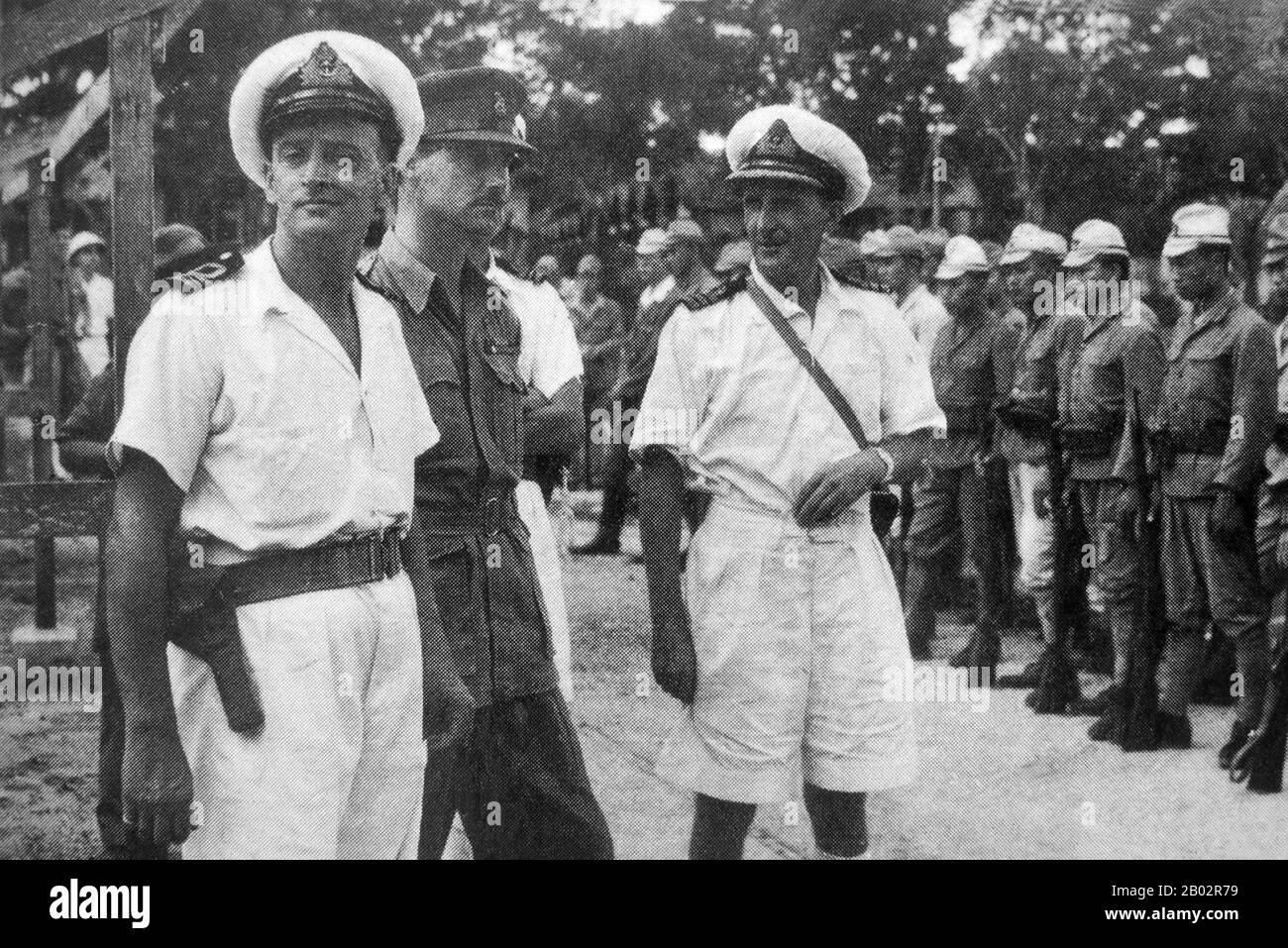 En septembre 1945, 20 000 soldats britanniques de la vingtième Division indienne occupaient Saigon sous le commandement du général Sir Douglas David Gracey. Lors de la Conférence de Potsdam en juillet 1945, les Alliés avaient convenu que la Grande-Bretagne prenait le contrôle du Vietnam au sud du XVIe parallèle (alors partie de l'Indochine française) des occupants japonais. Pendant ce temps, Ho Chi Minh a proclamé l'indépendance vietnamienne du gouvernement français et d'importantes manifestations pro-indépendantes et anti-françaises ont eu lieu à Saigon. Ho Chi Minh était le chef du Viet Minh communiste. Les Français, soucieux de conserver leur colonie, ont persuadé Grace Banque D'Images
