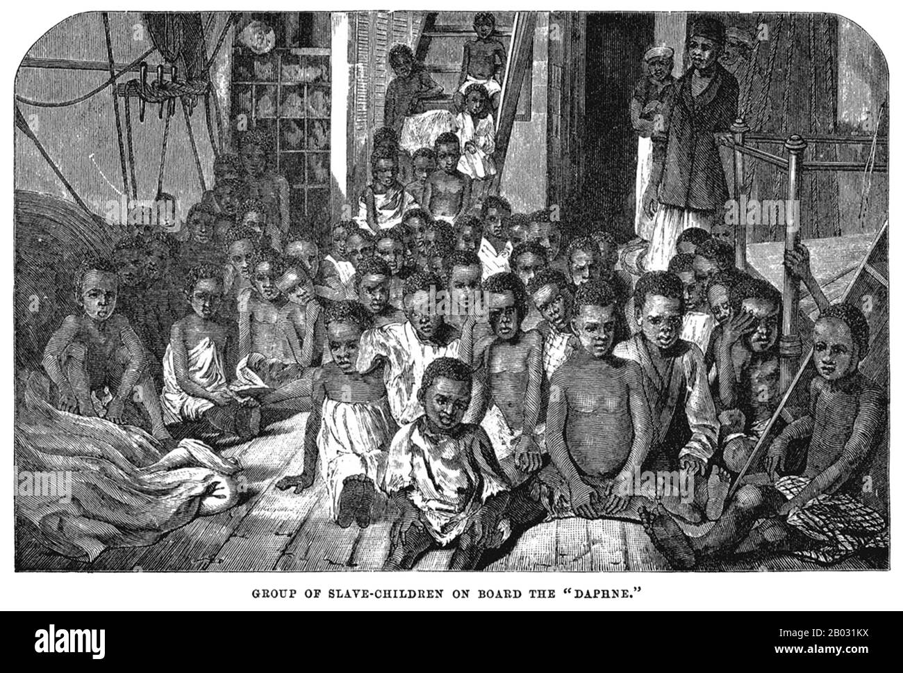 Ces enfants sont parmi les quatre-vingt-quinze qui ont été sauvés de l'esclavage par un navire britannique (le Daphné) patrouiller les eaux au large de Zanzibar en 1869. Après l'abolition du commerce des esclaves par le Parlement, les navires de la Marine royale ont été affectés pour intercepter les castors et libérer la cargaison humaine à bord. Bien que cette gravure, basée sur une photo de George Sullivan, décrit les conditions le long de la rive orientale de l'Afrique, la même situation existait du côté atlantique. Banque D'Images