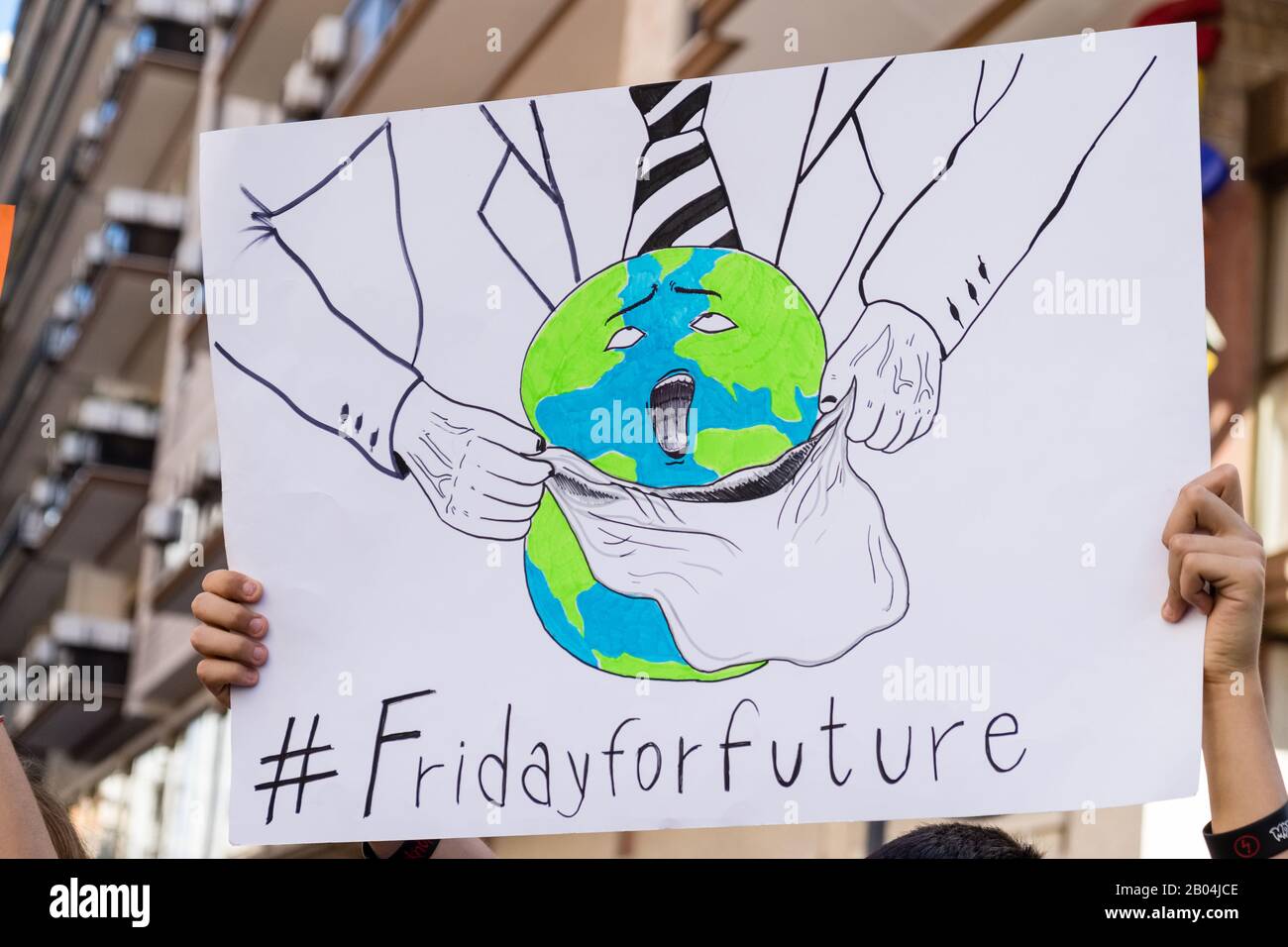 Un signe protestant au cours d'une marche contre le changement climatique. Banque D'Images