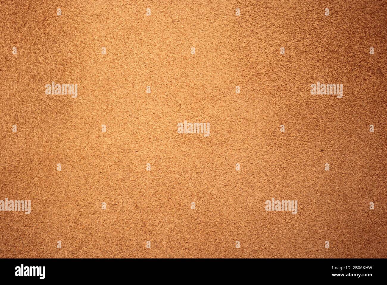 Texture chamois, daim brun clair. Arrière-plan en cuir de schabby, motif de peau naturel. Surface de tissu rugueuse Banque D'Images