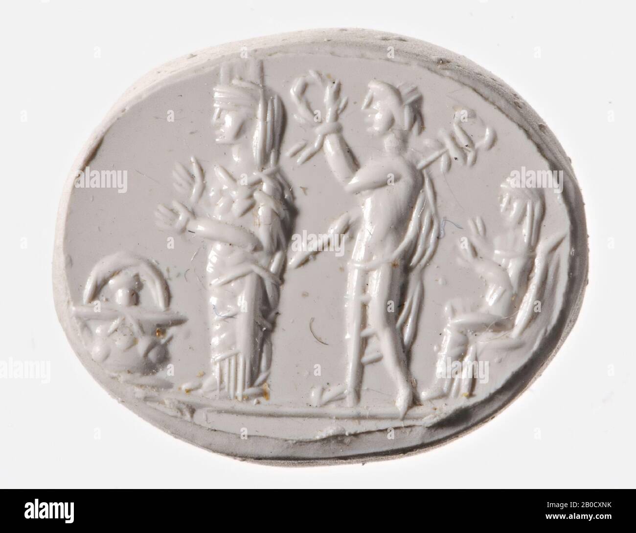 VZ: Pour un panier contenant un objet non identifié, une statue culte d'Artémis (Aphrodisias?), Mercure se tient derrière la statue du culte et a dans sa main gauche un caducée et dans sa main droite une couronne avec laquelle il va la déesse couronnes, Derrière Mercure se trouve une figure féminine avec les deux bras étirés, peut-être c'est une statue d'une déesse ou d'une prêtresse., GEM, intaglio, ringstone, jasper, couleur: Rouge, forme: Ovale, usinage: Dans anneau en bronze ancien , anneau de diamètre 21 Banque D'Images