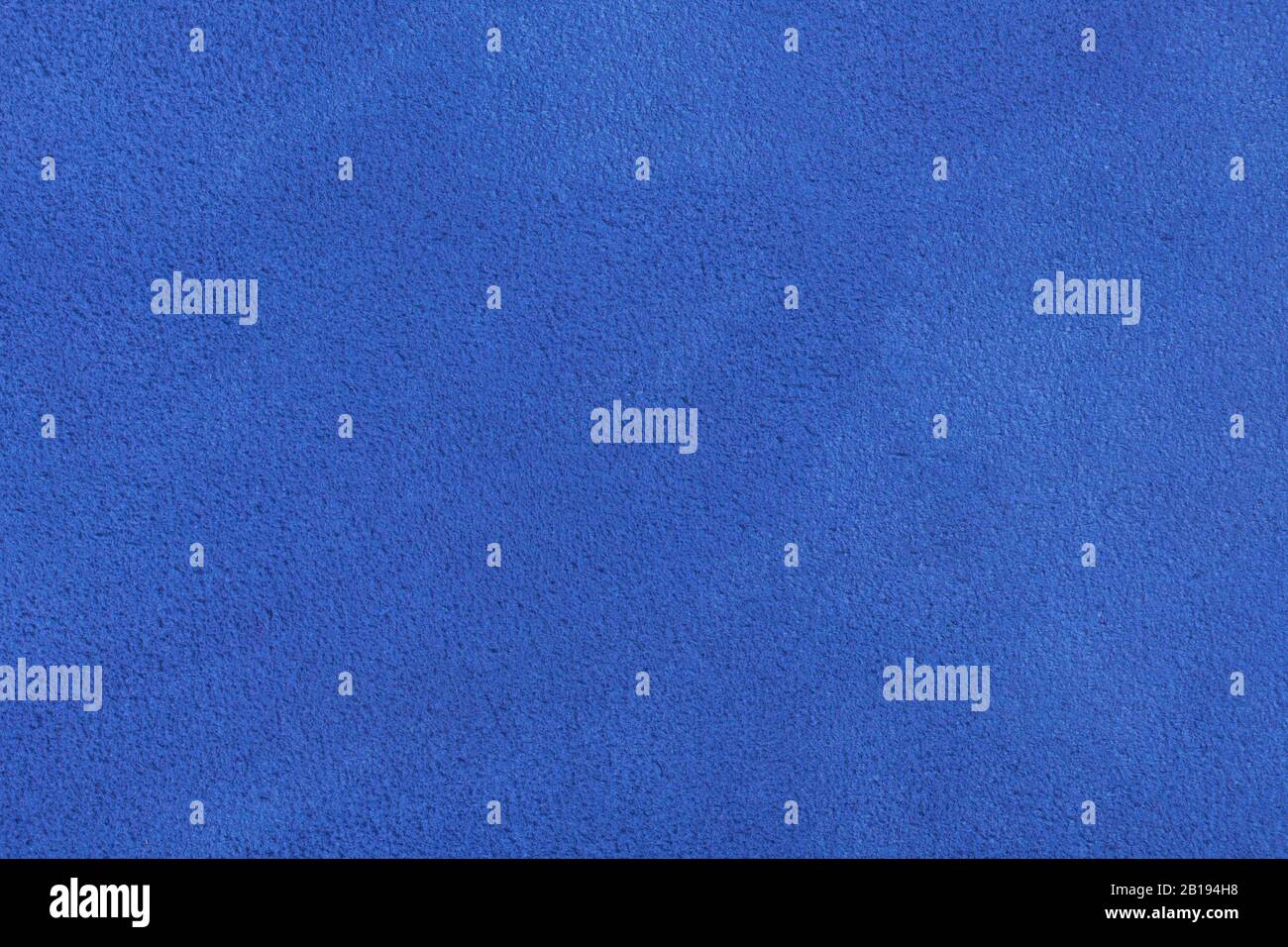 Gros plan sur une texture de velours bleu. Banque D'Images