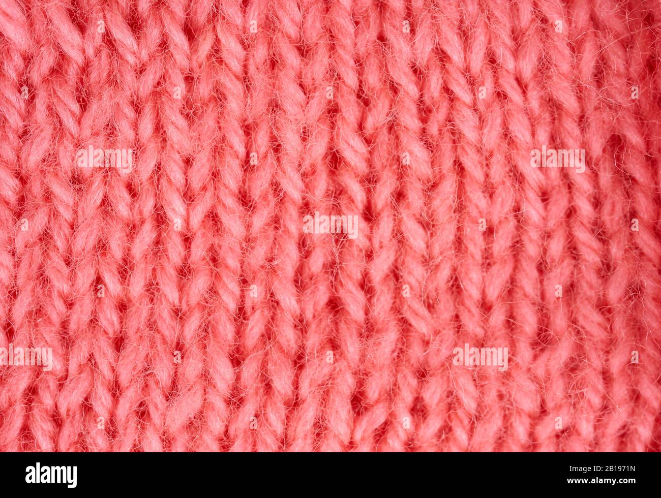 Partie de vêtements en laine tricotés roses comme arrière-plan Banque D'Images