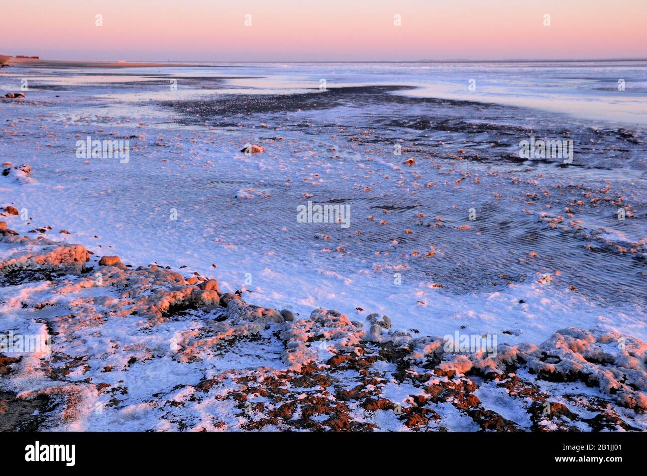Mer gelée de wadden au lever du soleil, Pays-Bas, Texel Banque D'Images