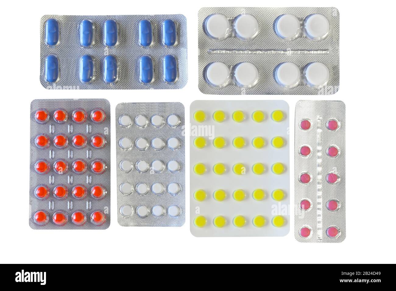 Pilules de différentes couleurs en blister, isolées sur fond blanc Banque D'Images