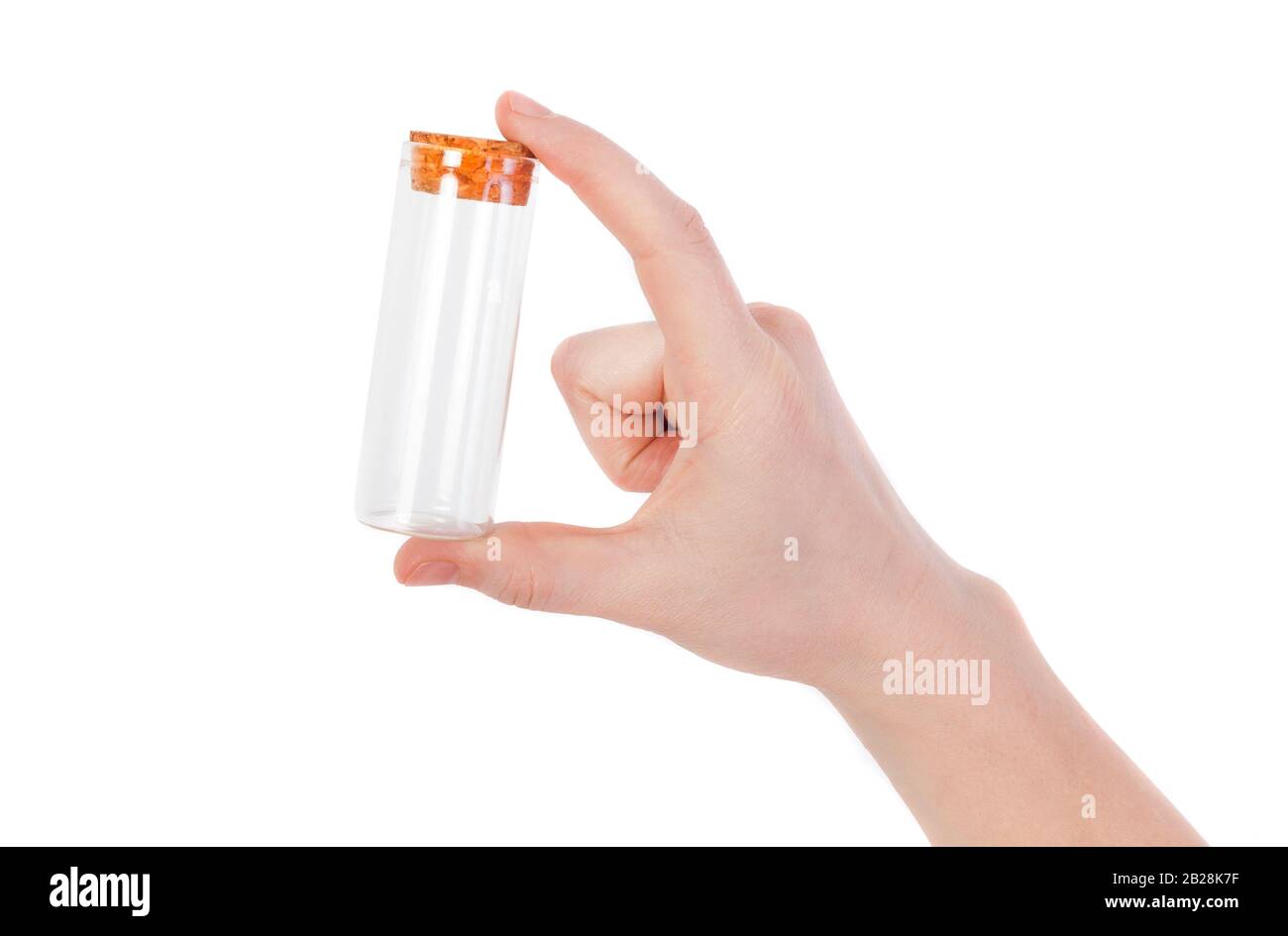 la main tenant la bouteille vide ou le tube en verre isolé sur fond blanc Banque D'Images