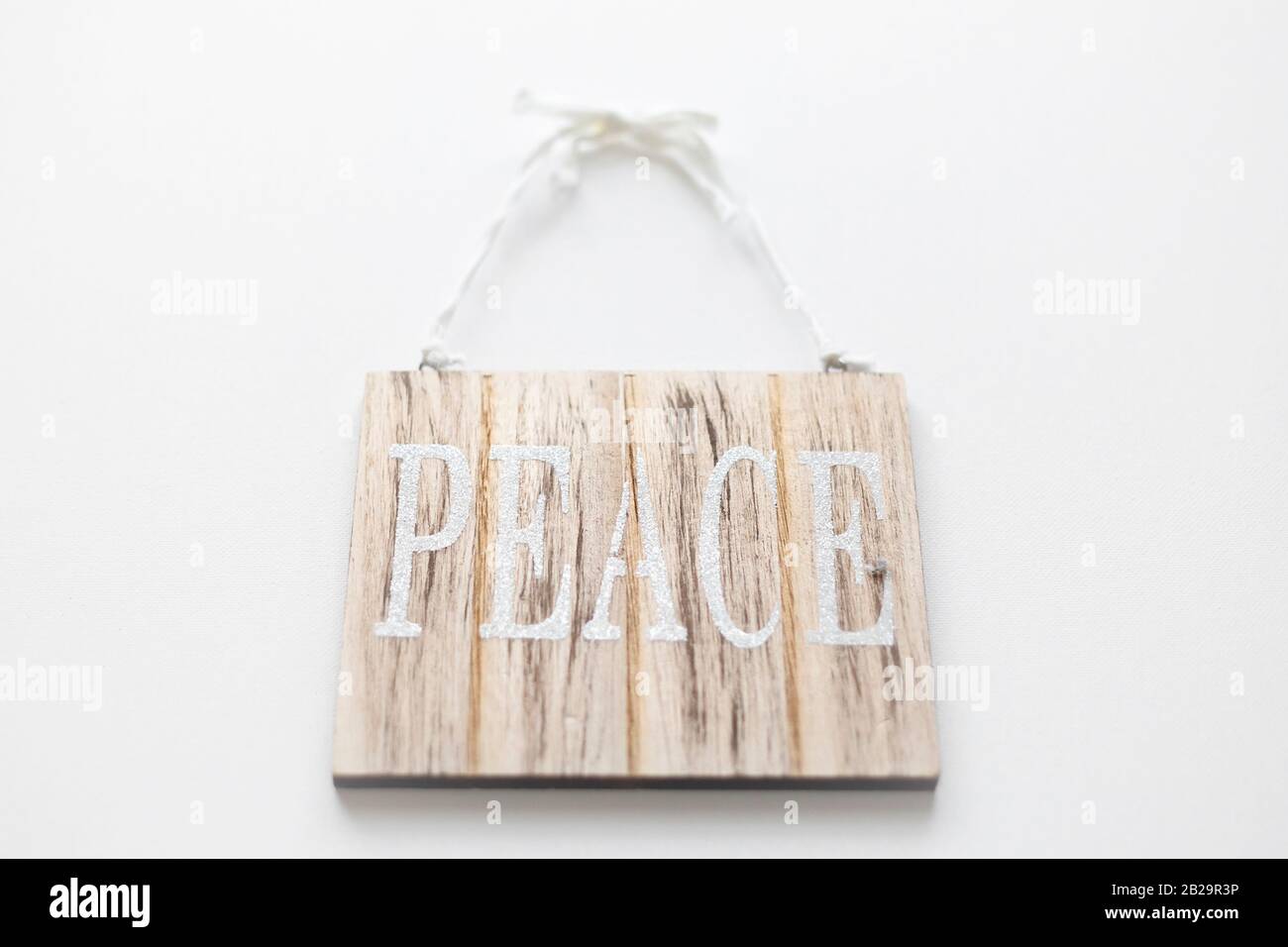 Signe de paix sur fond blanc. Banque D'Images