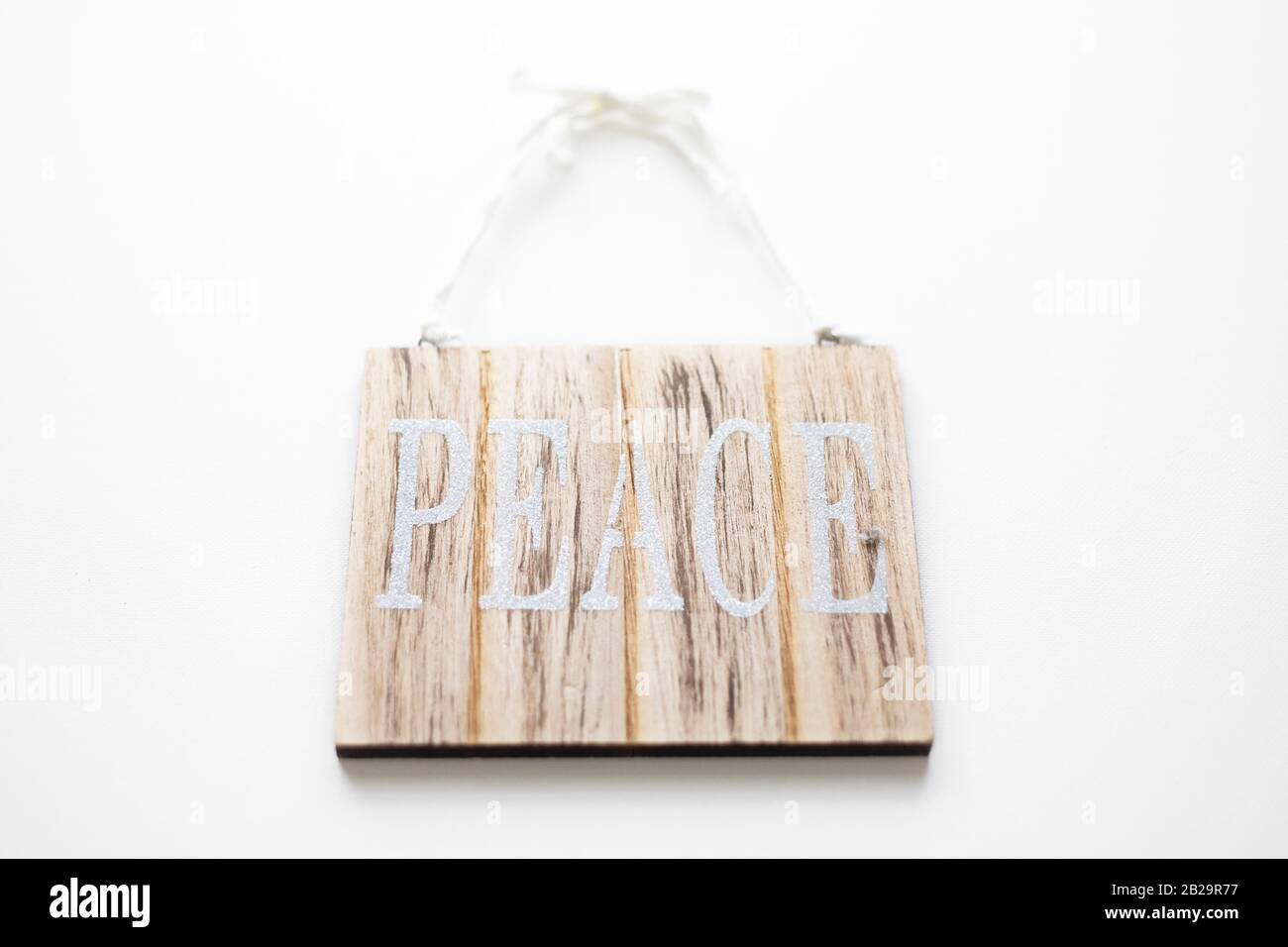 Signe de paix sur fond blanc. Banque D'Images